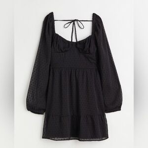 Elegant above-knee chiffon black dress.